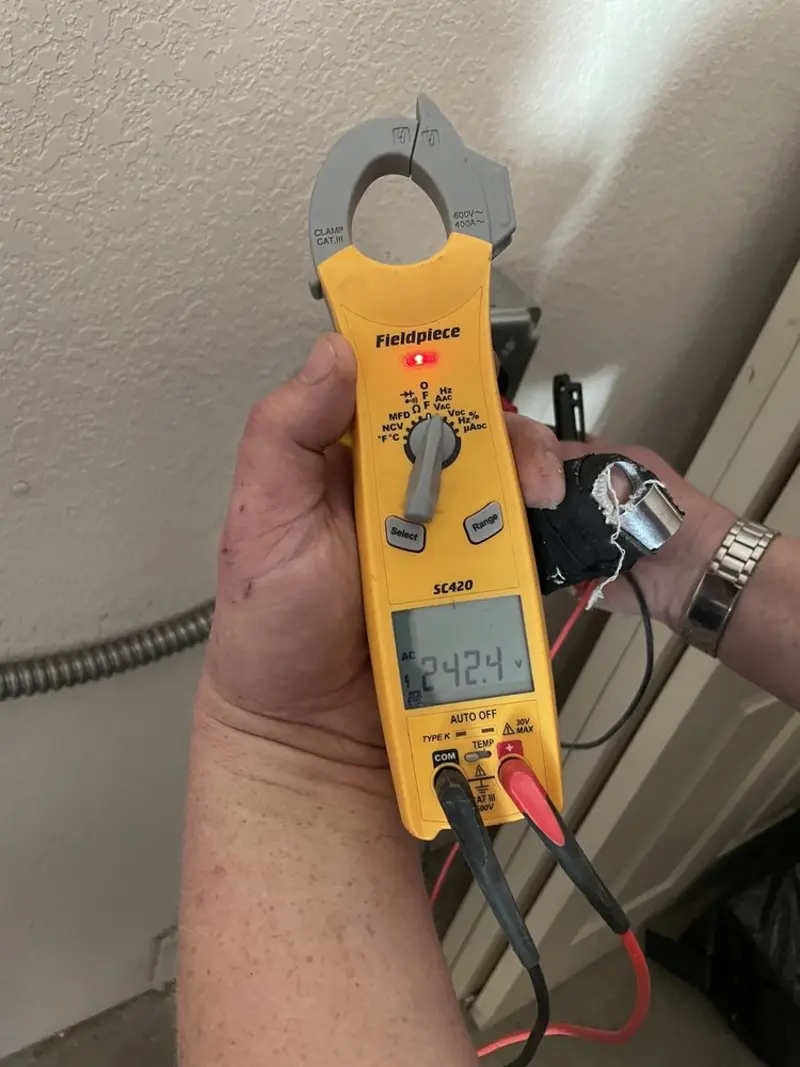Voltage testing with clamp meter during Generator Installation in Medford